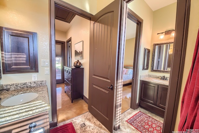 ensuite bathroom featuring ensuite bathroom and vanity