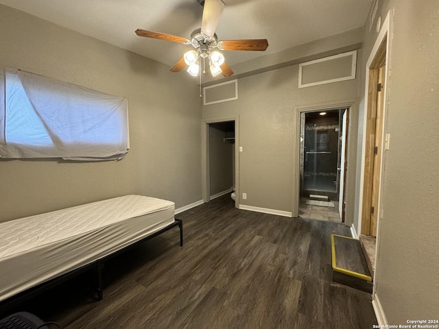 unfurnished bedroom featuring a ceiling fan, baseboards, and wood finished floors