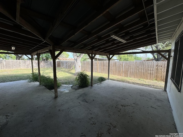 view of patio featuring fence