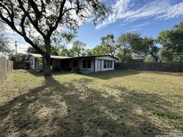 view of yard with a fenced backyard