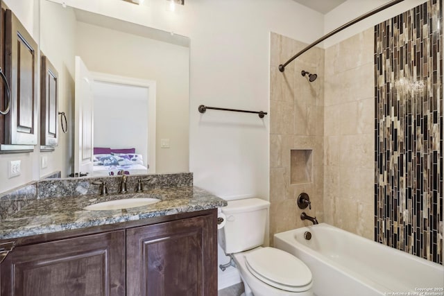 full bathroom with vanity, ensuite bath, toilet, and tub / shower combination