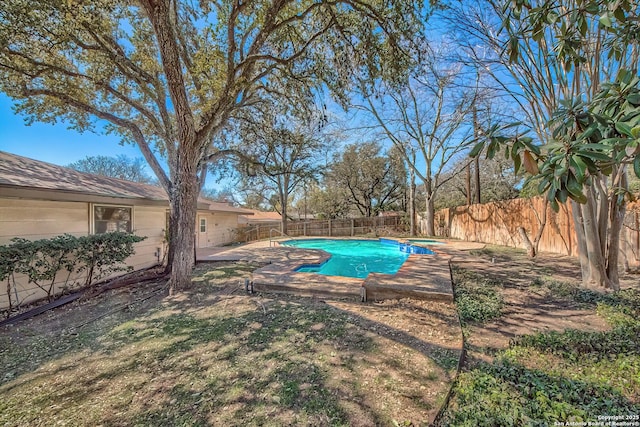 view of swimming pool with a patio area, a fenced in pool, and a fenced backyard