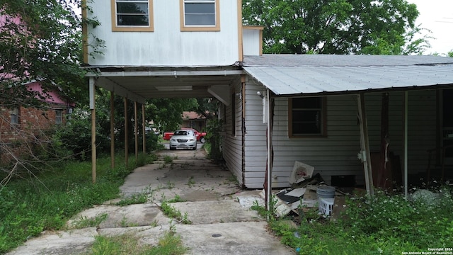 view of parking / parking lot featuring a carport