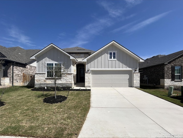 view of front of property featuring stone siding, board and batten siding, concrete driveway, and a front lawn