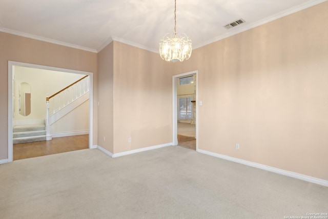 carpeted spare room featuring visible vents, stairs, baseboards, and ornamental molding