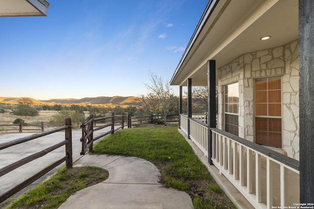 view of yard with a mountain view and fence