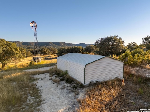 view of outdoor structure featuring a mountain view