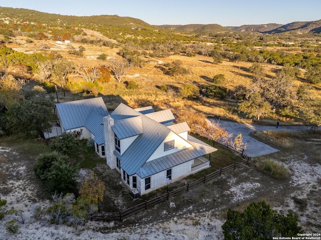 birds eye view of property with a mountain view