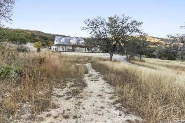 exterior space with a rural view and a mountain view