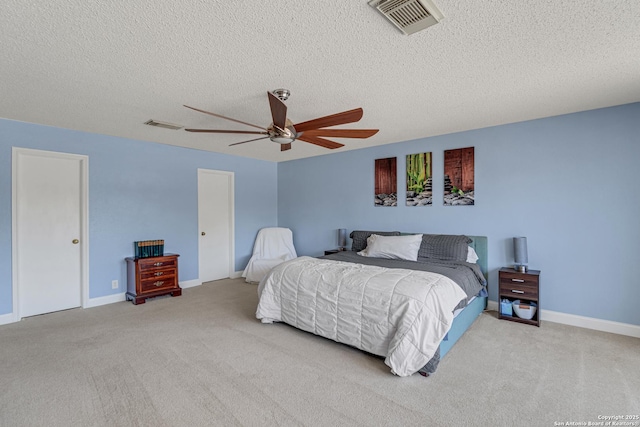 bedroom featuring a ceiling fan, carpet, and visible vents