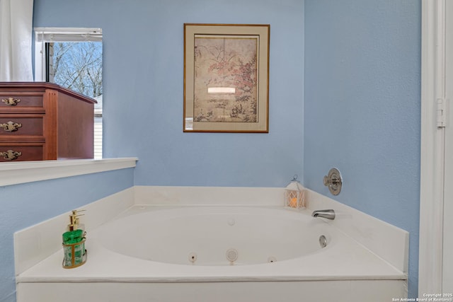 bathroom featuring a jetted tub