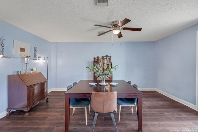 dining area featuring wood finished floors, visible vents, baseboards, ceiling fan, and a textured ceiling