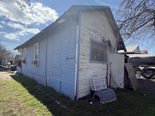 view of home's exterior featuring a yard and fence