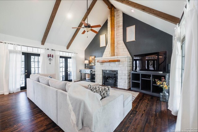 living area featuring beamed ceiling, french doors, high vaulted ceiling, and wood finished floors