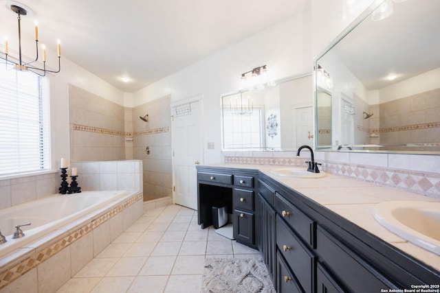 bathroom with double vanity, tiled shower, a garden tub, and a sink