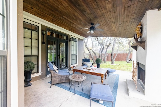 view of patio / terrace with french doors, ceiling fan, and fence