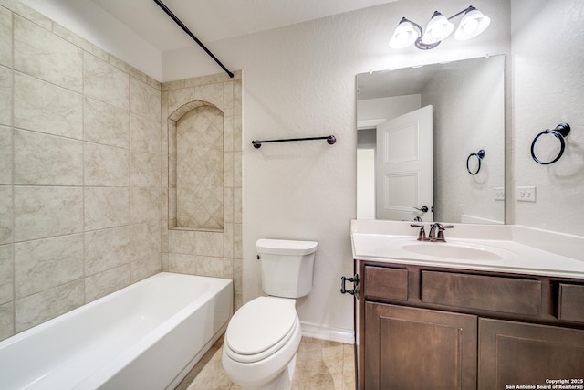 bathroom with tile patterned floors, toilet, shower / washtub combination, baseboards, and vanity