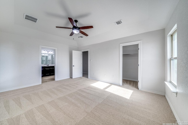 unfurnished bedroom featuring light carpet, visible vents, and baseboards