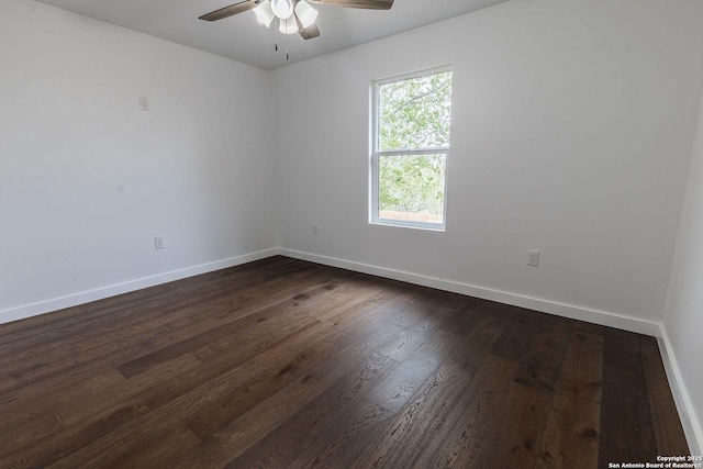 unfurnished room featuring a ceiling fan, baseboards, and dark wood-style flooring