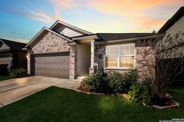 ranch-style house featuring concrete driveway, an attached garage, brick siding, and a front lawn