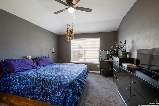 bedroom with baseboards, lofted ceiling, a ceiling fan, and carpet flooring