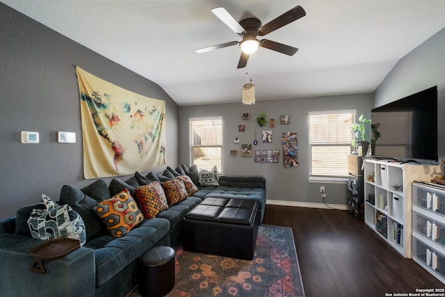 living room with baseboards, lofted ceiling, a healthy amount of sunlight, and wood finished floors