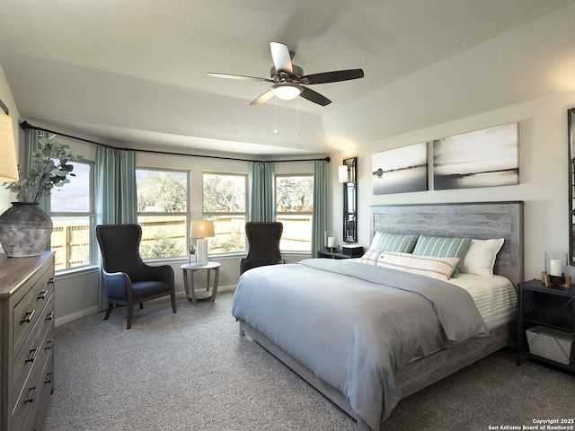 carpeted bedroom featuring ceiling fan and baseboards