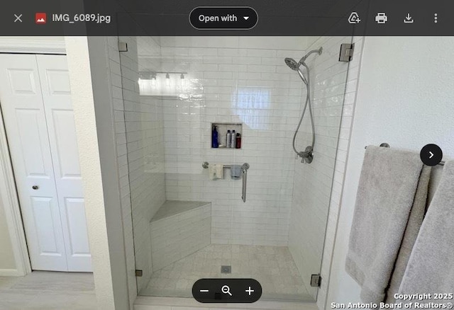 bathroom featuring a shower stall