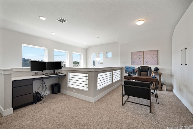 office space featuring visible vents, a textured ceiling, recessed lighting, carpet floors, and baseboards