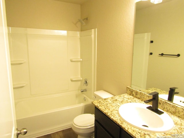 full bath with vanity, shower / bathing tub combination, toilet, and wood finished floors