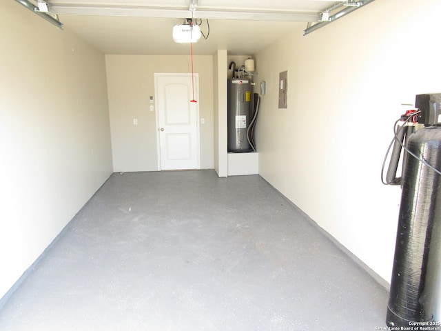 garage featuring electric panel, a garage door opener, and water heater