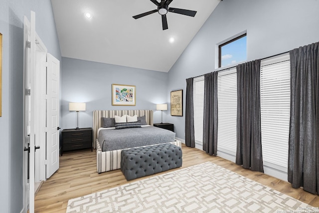 bedroom featuring recessed lighting, high vaulted ceiling, light wood-style flooring, and a ceiling fan