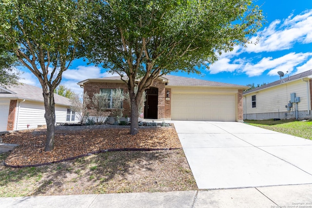 ranch-style house with a garage, brick siding, and concrete driveway