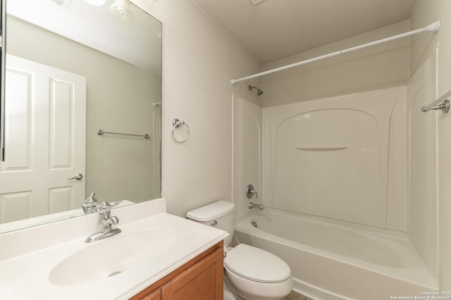 bathroom featuring vanity, toilet, and shower / bathtub combination