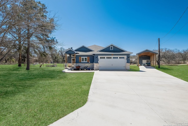 view of front of home featuring a front yard, concrete driveway, board and batten siding, and an attached garage