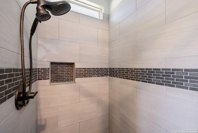 full bathroom featuring tiled shower