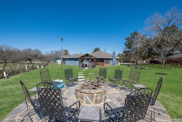 view of patio with outdoor dining area and an outbuilding