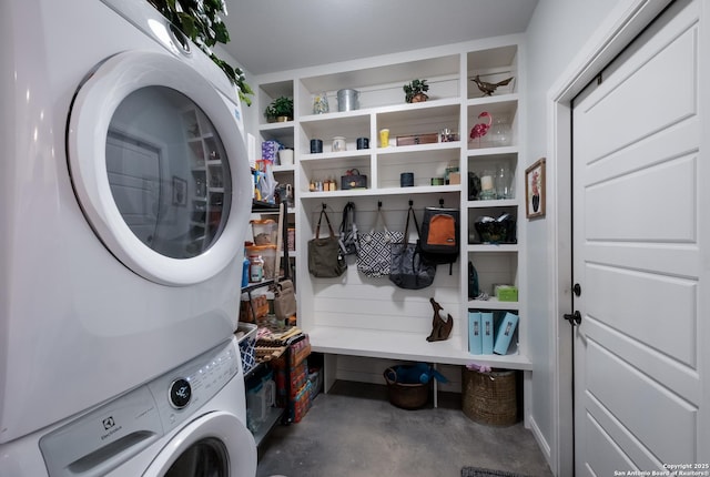 interior space featuring laundry area and stacked washing maching and dryer