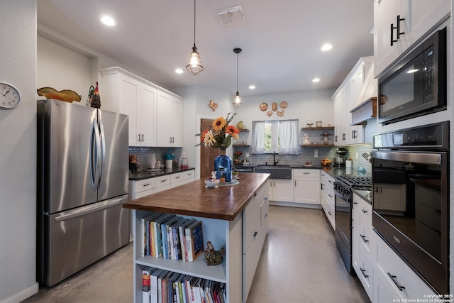 kitchen featuring visible vents, butcher block countertops, black appliances, open shelves, and finished concrete flooring