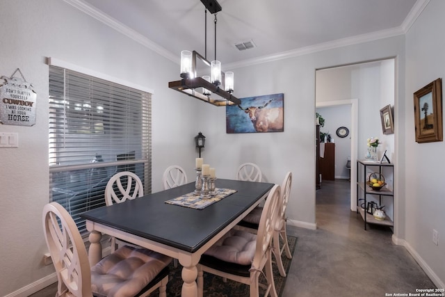 dining room with visible vents, finished concrete flooring, baseboards, and ornamental molding