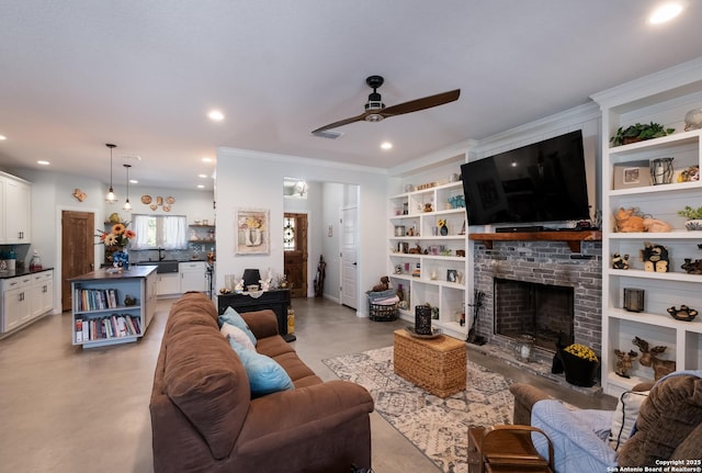 living room with recessed lighting, concrete floors, a brick fireplace, and ceiling fan