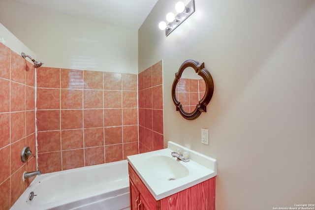 bathroom featuring  shower combination and vanity