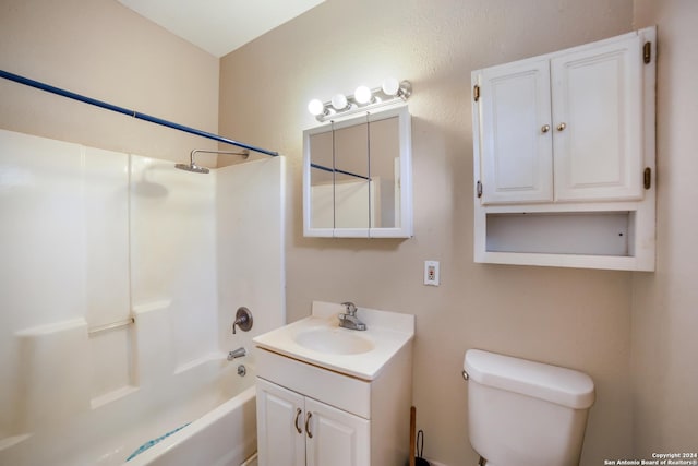 bathroom with vanity, washtub / shower combination, and toilet