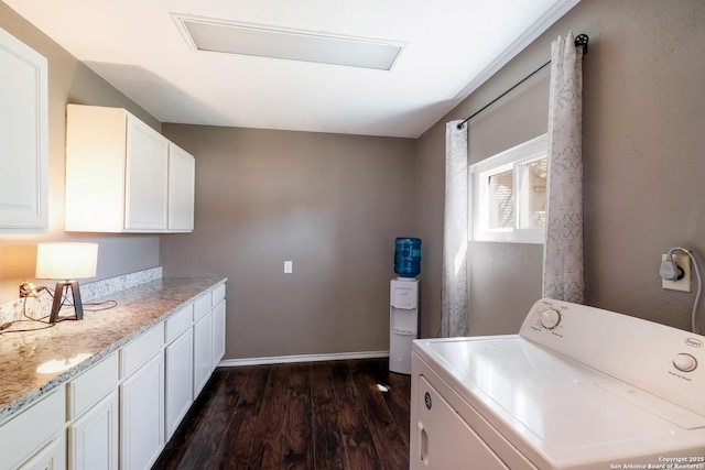 washroom featuring laundry area, washer / clothes dryer, baseboards, and dark wood-style flooring