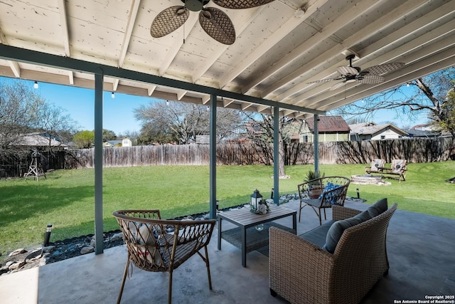 view of patio featuring ceiling fan, outdoor lounge area, and a fenced backyard