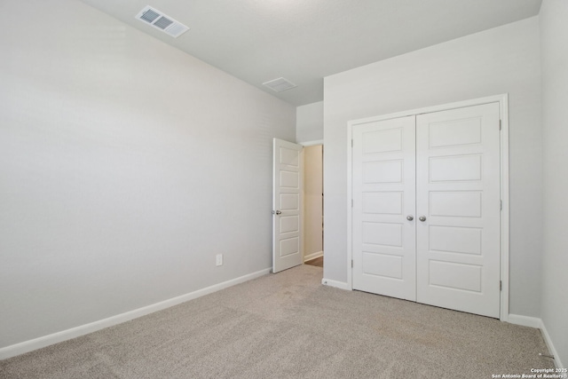 11583 Cottage Pt, San Antonio, TX 78254 - unfurnished bedroom featuring a closet, carpet, visible vents, and baseboards