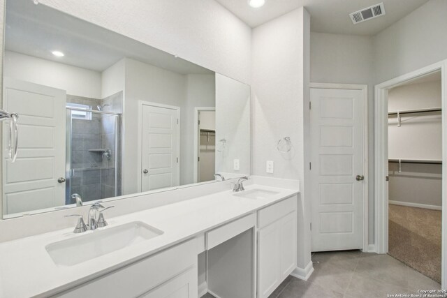 11583 Cottage Pt, San Antonio, TX 78254 - full bath featuring a stall shower, a sink, tile patterned flooring, and visible vents