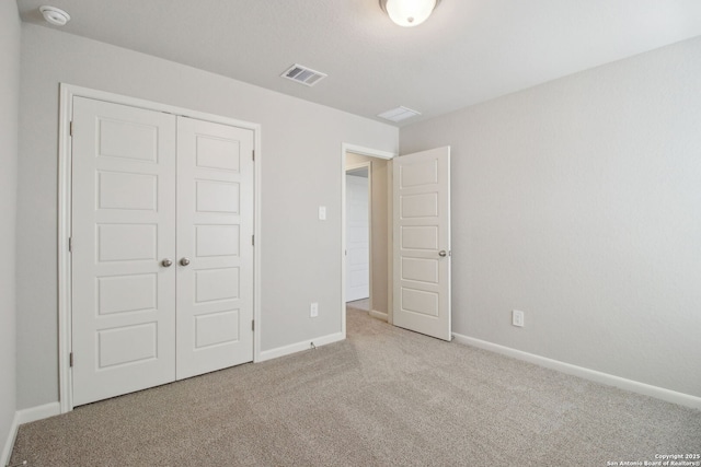 11583 Cottage Pt, San Antonio, TX 78254 - unfurnished bedroom with carpet, visible vents, a closet, and baseboards