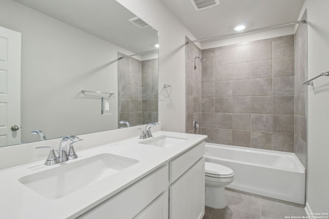 11583 Cottage Pt, San Antonio, TX 78254 - full bathroom featuring a sink, visible vents, toilet, and tile patterned flooring