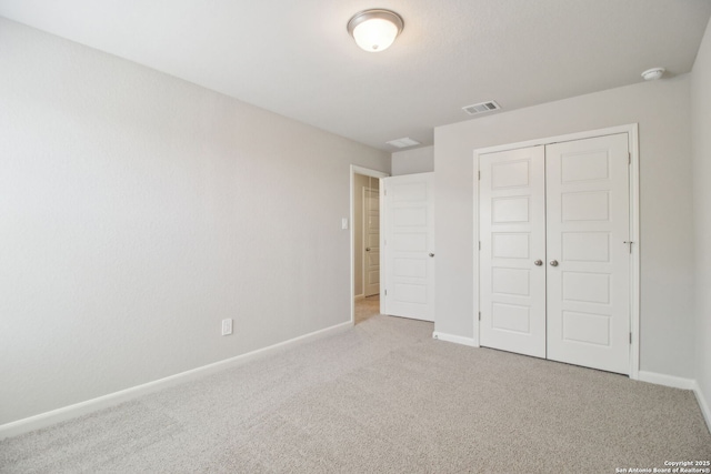 11583 Cottage Pt, San Antonio, TX 78254 - unfurnished bedroom with a closet, carpet, visible vents, and baseboards
